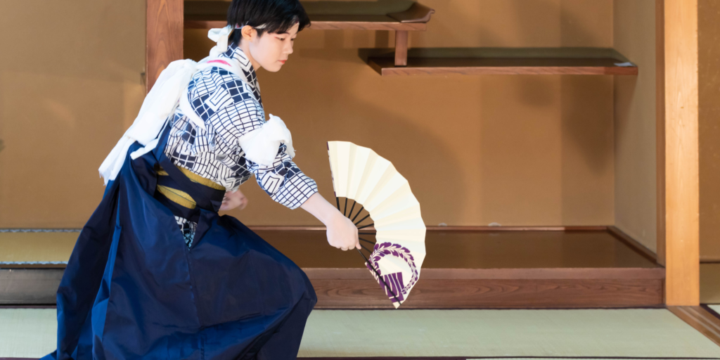 14 April Dates to Celebrate - This is a photo of Japanese Fan Dance, they are wearing a traditional hakama.