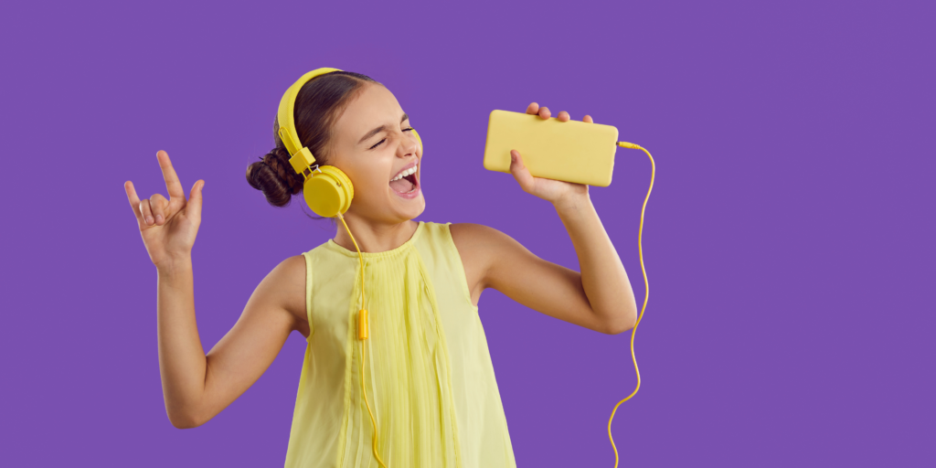 Learning Lands – Our award-winning online learning platform: this is a picture of a girls wearing headphones and listening to music