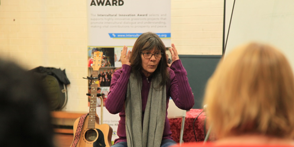 Celebrating NAIDOC Week Outside of NAIDOC Week: This is a photo of Cultural Infusion's First Nations presenter Aunty Monica, who facilitates Aboriginal symbolic art cultural education programs.