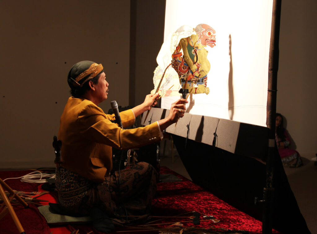 Pak Sumardi performing with Wayang Kulit