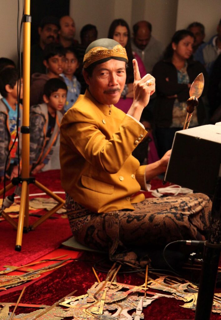 Pak Sumardi performing with Wayang Kulit
